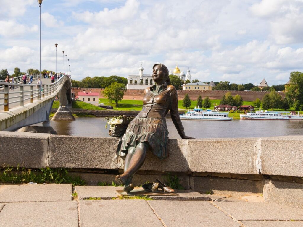 Monument. Tired Tourist Girl Monument in Veliky Novgorod. Sculptor Vadim Borovykh.